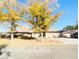 Single-story home with mature trees and a spacious front yard at 3690 S Rosecrest Cir, Las Vegas, NV 89121