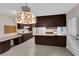 Traditional kitchen with dark wood cabinetry and ample counter space at 3690 S Rosecrest Cir, Las Vegas, NV 89121