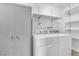 This laundry room has a washer, dryer, and shelves at 3690 S Rosecrest Cir, Las Vegas, NV 89121