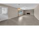 Open living area featuring tile flooring, a brick fireplace, and a ceiling fan, perfect for relaxation at 3690 S Rosecrest Cir, Las Vegas, NV 89121