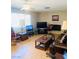 Living room featuring a fireplace and ample natural light at 3690 S Rosecrest Cir, Las Vegas, NV 89121