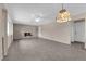 Spacious living room with tile floors, neutral walls, and a brick fireplace, ready for personalization at 3690 S Rosecrest Cir, Las Vegas, NV 89121