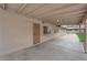 Large covered patio featuring concrete flooring, access door, and exterior lighting at 3690 S Rosecrest Cir, Las Vegas, NV 89121