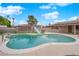 Inviting in-ground pool with slide and diving board in a private backyard, perfect for entertaining at 3690 S Rosecrest Cir, Las Vegas, NV 89121