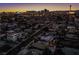 Aerial view of home with pool, showcasing Las Vegas skyline in background at 1625 Phillips Ave, Las Vegas, NV 89104