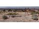 View of a vacant lot with rocky terrain and distant city skyline at 440 Probst, Las Vegas, NV 89110