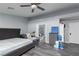 Grey bedroom with a king bed and access to the bathroom at 440 Probst, Las Vegas, NV 89110