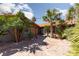 Landscaped courtyard with palm trees and flagstone at 440 Probst, Las Vegas, NV 89110