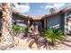 Elegant entryway with ornate doors, fountain, and lush landscaping at 440 Probst, Las Vegas, NV 89110