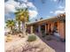 Covered patio with seating area and orange curtains at 440 Probst, Las Vegas, NV 89110