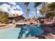 Relaxing pool area with rock features and palm trees at 440 Probst, Las Vegas, NV 89110