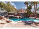 Inviting pool with rock waterfall feature and desert landscaping at 440 Probst, Las Vegas, NV 89110