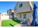 Artificial turf backyard with patio furniture at 5029 Bloodhound St, Las Vegas, NV 89122