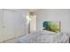 Bedroom with a double bed, large closet, and tropical art at 5029 Bloodhound St, Las Vegas, NV 89122