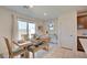 Bright dining area with wooden table and seating for four at 5029 Bloodhound St, Las Vegas, NV 89122