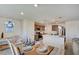 Kitchen and dining area with a large island and table setting at 5029 Bloodhound St, Las Vegas, NV 89122