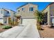 Two-story house with attached garage and landscaped front yard at 5029 Bloodhound St, Las Vegas, NV 89122