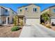 Two-story house with attached garage and landscaped front yard at 5029 Bloodhound St, Las Vegas, NV 89122