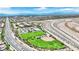 Aerial view of community, nearby buildings, schools and roads with mountain backdrop at 952 Contadero Pl, Las Vegas, NV 89138