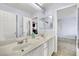 Bathroom with dual sinks, marble countertops, sleek hardware, and ample storage underneath at 952 Contadero Pl, Las Vegas, NV 89138