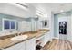 Bathroom featuring double sinks, soaking tub, and glass-enclosed shower at 952 Contadero Pl, Las Vegas, NV 89138