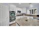 Well-equipped kitchen featuring double ovens and granite countertops at 952 Contadero Pl, Las Vegas, NV 89138