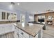 Bright kitchen featuring a large island, granite countertops, and modern appliances at 952 Contadero Pl, Las Vegas, NV 89138