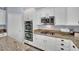 Modern kitchen with white cabinets and granite countertops at 952 Contadero Pl, Las Vegas, NV 89138