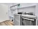 Well-organized laundry room with modern washer and dryer and ample shelving at 952 Contadero Pl, Las Vegas, NV 89138