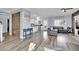 Open living space with stone wall and view into kitchen at 952 Contadero Pl, Las Vegas, NV 89138