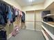 Spacious walk-in closet with ample shelving and hanging rods at 6437 Boatbill St, North Las Vegas, NV 89084