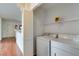 Bright laundry room with washer, dryer, and shelving at 2110 Los Feliz St # 1097, Las Vegas, NV 89156