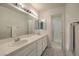 Double vanity bathroom with large mirror and shower at 2725 S Nellis Blvd # 1096, Las Vegas, NV 89121