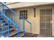 Exterior building entrance with blue stairs and security door at 2725 S Nellis Blvd # 1096, Las Vegas, NV 89121