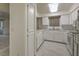 Kitchen with white cabinets, tile floor and appliances at 2725 S Nellis Blvd # 1096, Las Vegas, NV 89121