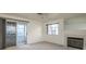 Living room with fireplace, balcony view and carpet flooring at 2725 S Nellis Blvd # 1096, Las Vegas, NV 89121