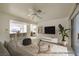 Bright living room features a ceiling fan, and a view into the kitchen at 2725 S Nellis Blvd # 1096, Las Vegas, NV 89121