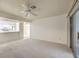 Open living room with kitchen views and sliding glass door at 2725 S Nellis Blvd # 1096, Las Vegas, NV 89121