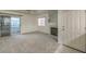 Living room with fireplace, sliding door to balcony and carpet flooring at 2725 S Nellis Blvd # 1096, Las Vegas, NV 89121