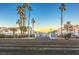 Community entrance with gated access and palm trees at 2725 S Nellis Blvd # 2096, Las Vegas, NV 89121