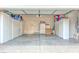Spacious garage with ample storage cabinets and lighting perfect for organizing your tools and vehicles at 716 Solitude Point Ave, Henderson, NV 89012