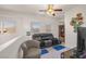 Upstairs living area features a reclining sofa and a ceiling fan at 716 Solitude Point Ave, Henderson, NV 89012