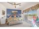 Bedroom featuring a floral comforter, balcony access, and stylish furnishings at 716 Solitude Point Ave, Henderson, NV 89012