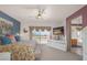 Spacious bedroom boasts balcony access, scenic views, and comfortable, stylish decor at 716 Solitude Point Ave, Henderson, NV 89012