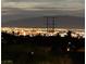 Backyard night view showcases city lights and mountains, providing a picturesque scenery at 716 Solitude Point Ave, Henderson, NV 89012