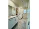 Bathroom featuring double sinks, granite countertops, and a walk-in closet at 8279 Palladium St, Las Vegas, NV 89113