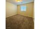 Neutral bedroom has wall to wall carpeting and bright window at 8279 Palladium St, Las Vegas, NV 89113