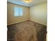 Neutral bedroom has wall to wall carpeting and bright window at 8279 Palladium St, Las Vegas, NV 89113