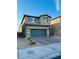 Two-story home featuring a two-car garage, low maintenance yard, and neutral color palette at 8279 Palladium St, Las Vegas, NV 89113