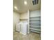 Spacious laundry area with appliances and shelving at 8279 Palladium St, Las Vegas, NV 89113